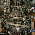 Chandelier in the Empire style with a metal frame and glass decorations from the castle in Kunin (before restoration)